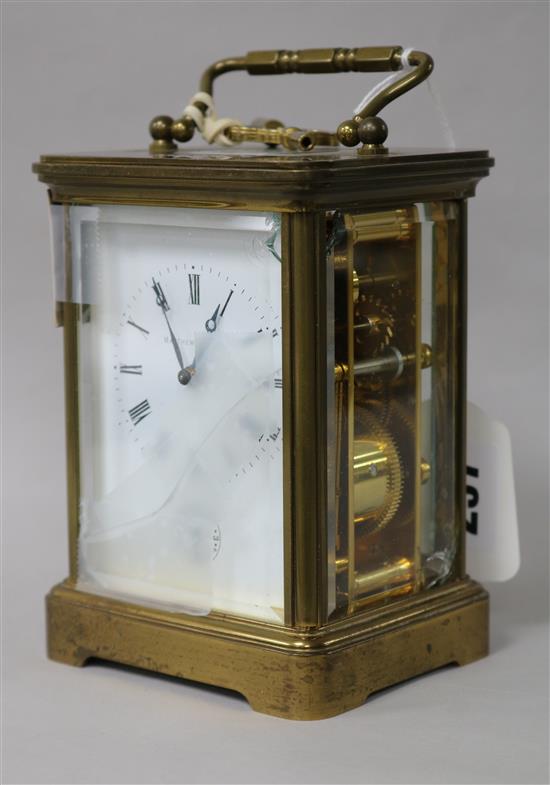 A Swiss gilt brass alarm carriage clock, retailed by Matthew Norman, London (three glass panels a.f.) H.14.5cm